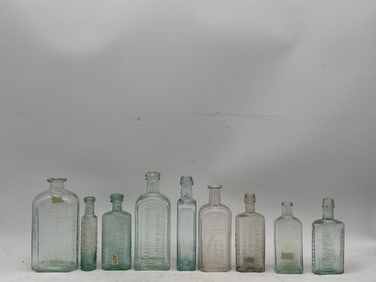 Nine Early American Apothecary Glass Bottles