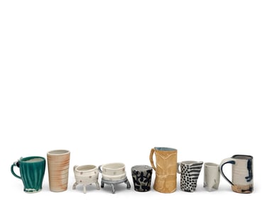 Nine Art Pottery Pitchers and Cups