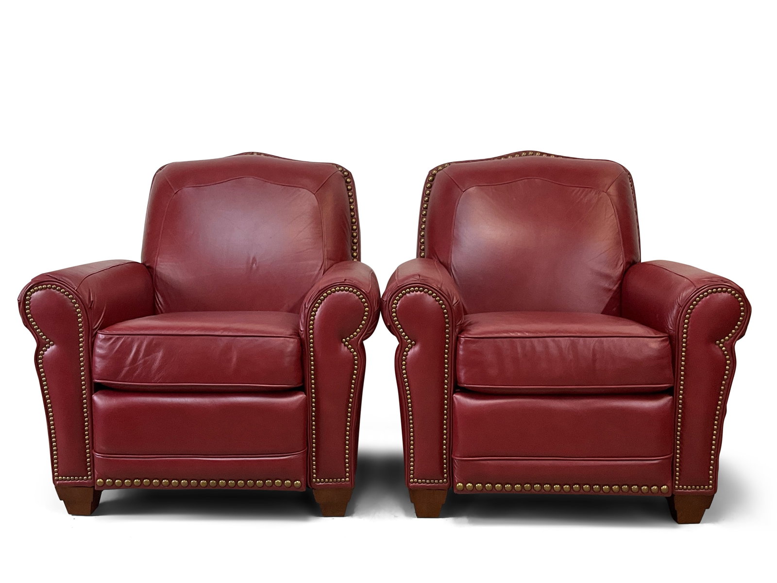 Pair of Lay-Z-Boy Red Leather Recliners: A pair of Lay-Z-Boy red leather recliners with tacked trim. 39in tall x 36in wide x 33in deep. | You have additional shipping options, and are not required to use Live Shipping. Additional third-party