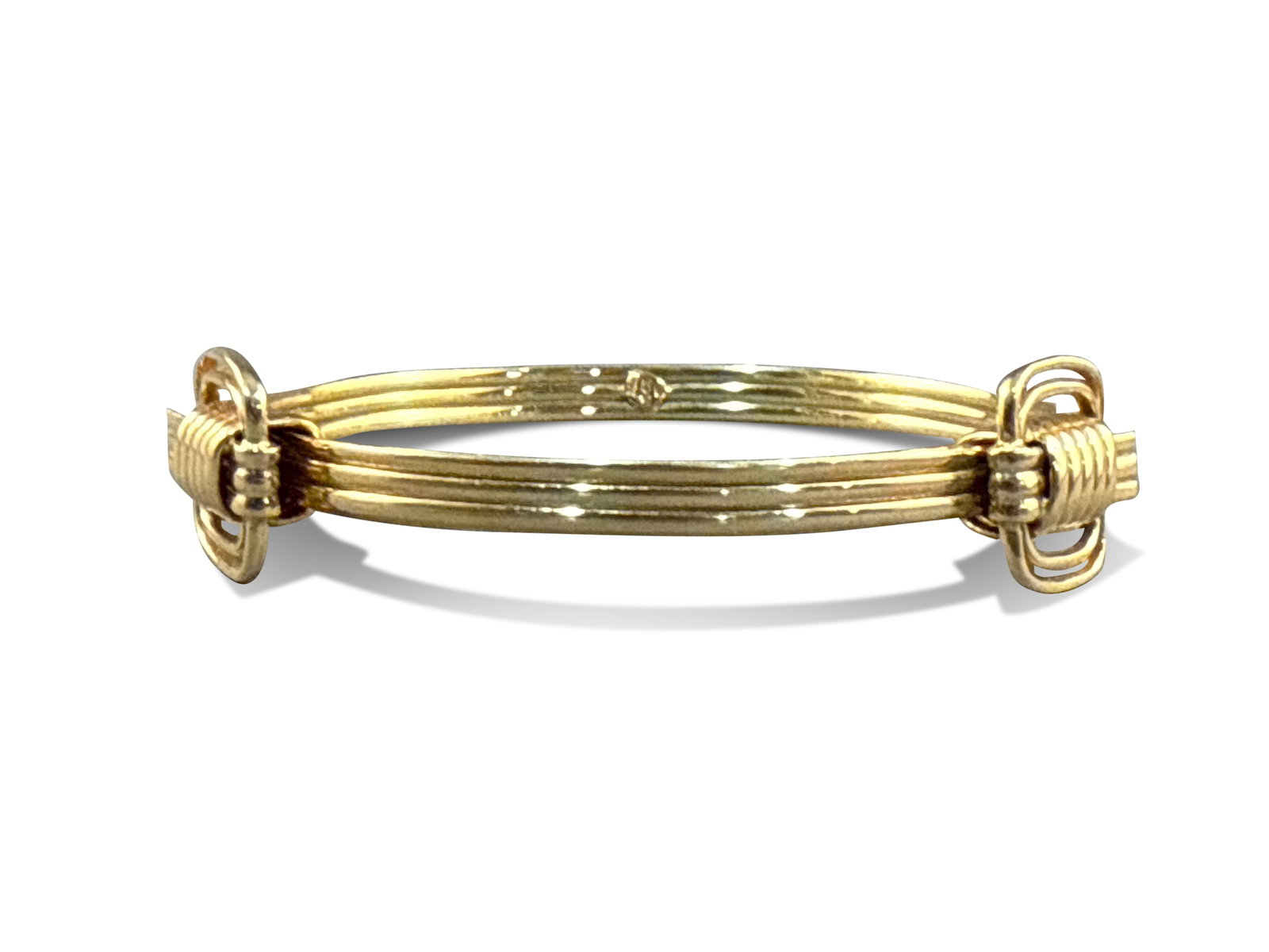 14K Yellow Gold AGA Correa Bangle Bracelet: A 14K yellow gold AGA Correa bangle bracelet with an overlapping slider/expandable design. 7-1/8in interior circumference. 15.2 dwt. | You have additional shipping options, and are not required to use