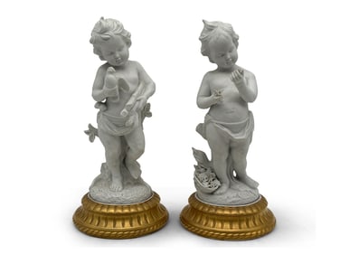 Two French Bisque Porcelain Putti Statues
