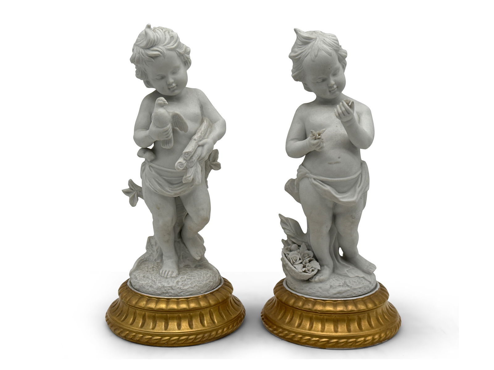 Two French Bisque Porcelain Putti Statues: Two French bisque porcelain putti statues with gilt painted bases. Marked France. Provenance: From a Rittenhouse Square, Philadelphia apartment designed by interior designer Barbara Eberlein. 10-1/2in
