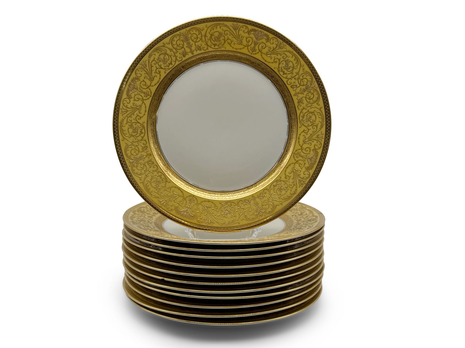 12 Rosenthal Ivory Bavarian Gilt-Decorated Plates: A set of 12 Rosenthal Ivory Bavarian dinner plates with yellow backgrounds and gilt-decorated floral designs. Marked verso. Provenance: From a Rittenhouse Square, Philadelphia apartment designed by in