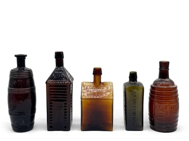 Five Early American Amber Glass Bottles