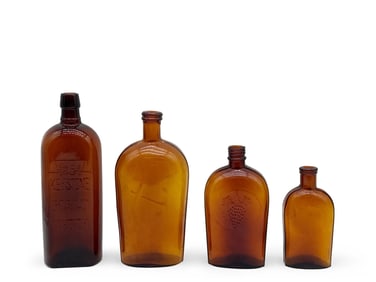 Four 19th C. Amber Glass Flasks