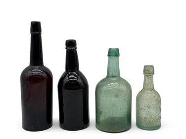 Four Early American Glass Whiskey Bottles