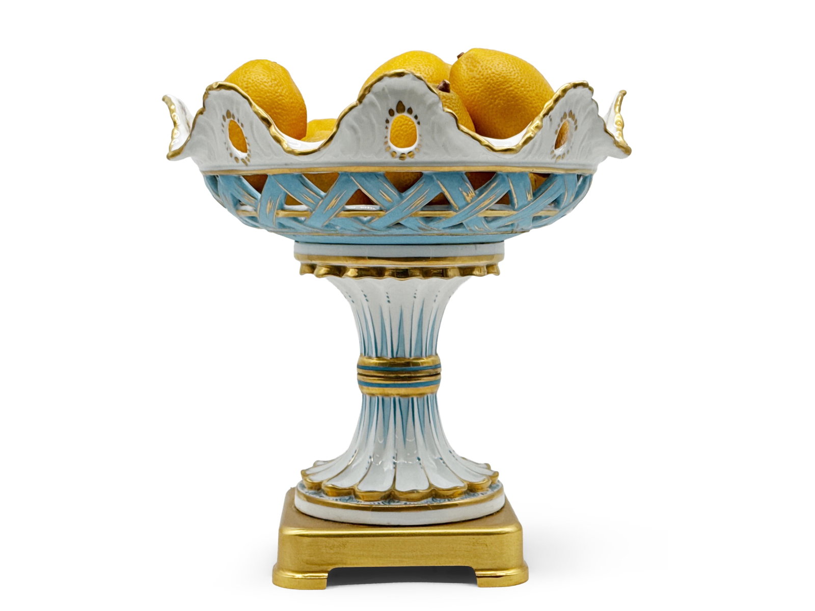 Italian Porcelain and Bronze Centerpiece Compote: An Italian "Tiche" porcelain compote with fretwork body and floral center, on a dore bronze base. Provenance: From a Rittenhouse Square, Philadelphia apartment designed by interior designer Barbara Eb