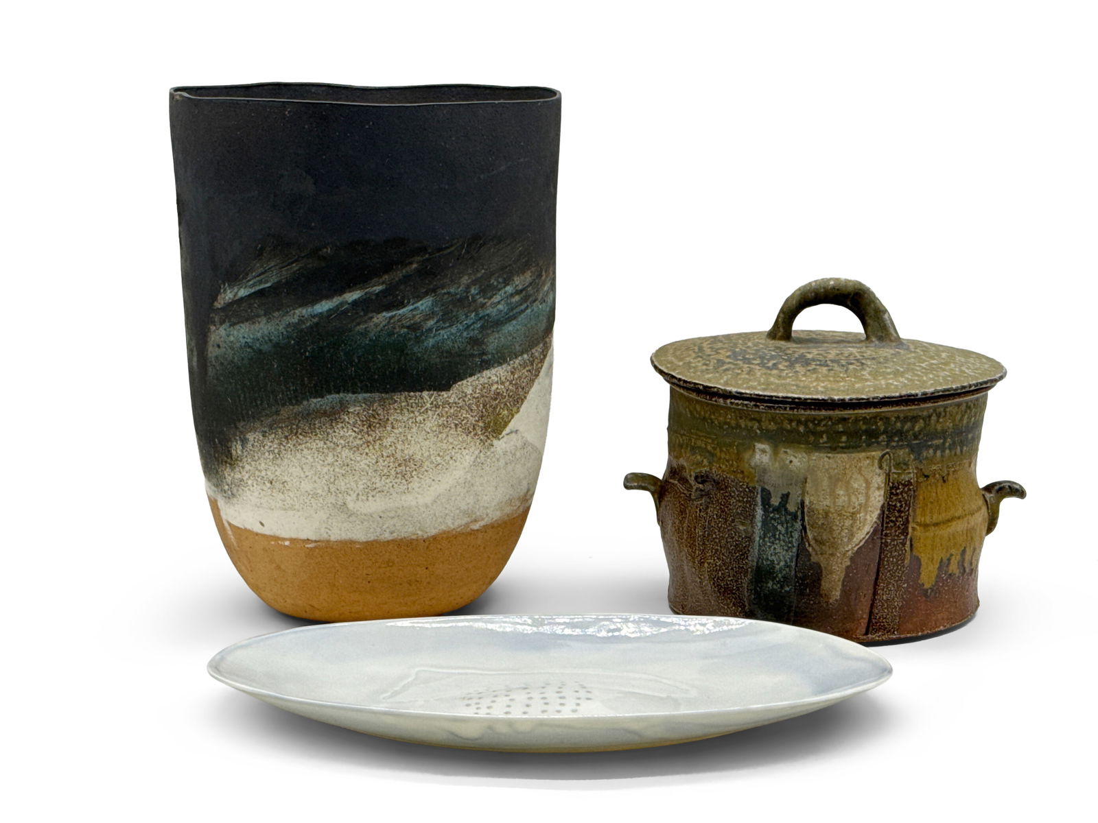 Three Pieces of American Studio Pottery: Three pieces of American studio pottery to include a Robert Winokur covered vessel, a Jill Bonovitz platter, and a large glazed vase signed "Lyons". Vase: 12-1/4in tall x 9-1/4in wide. | You have addi