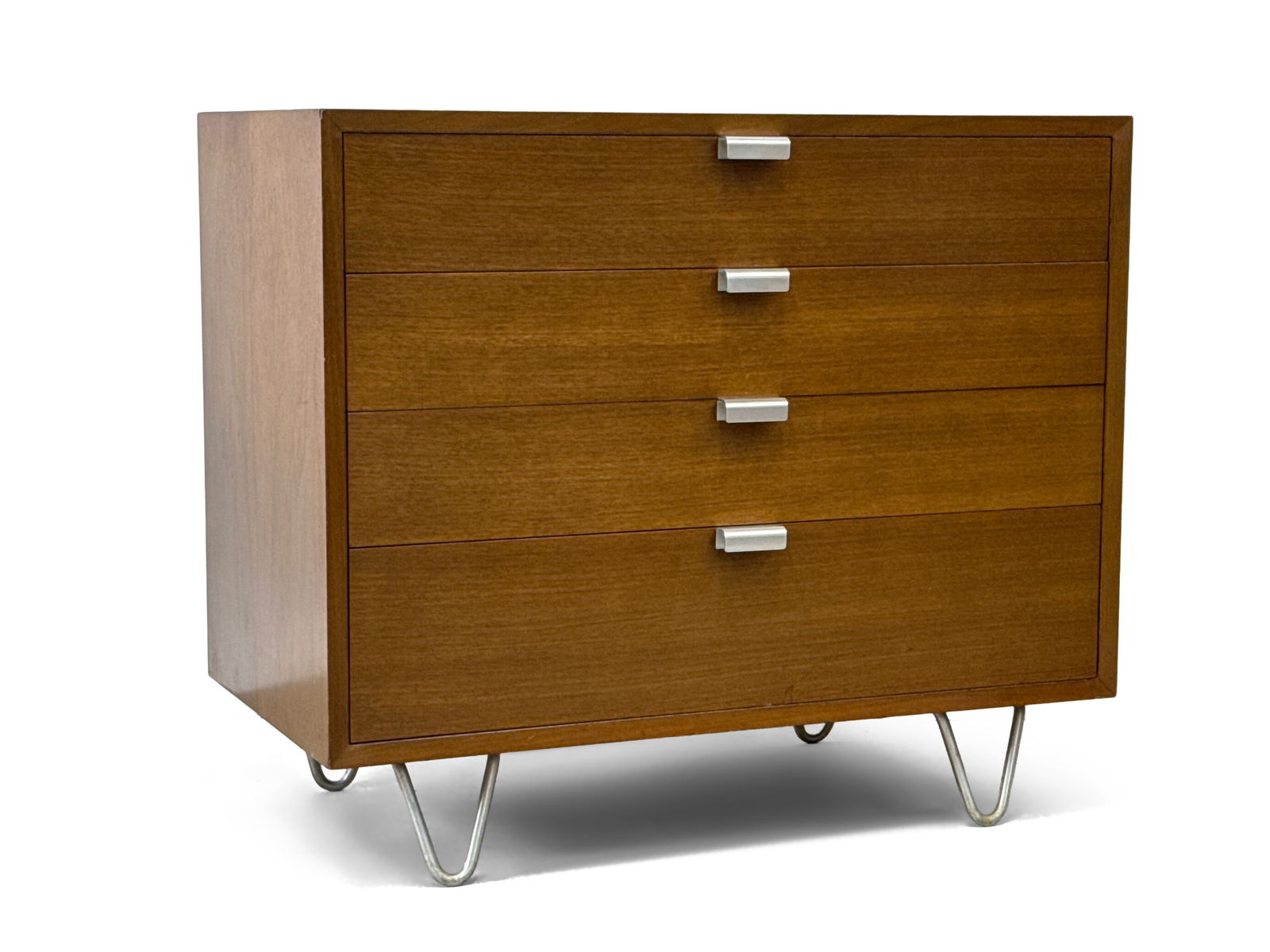 George Nelson/Herman Miller BCS Chest of Drawers: A George Nelson for Herman Miller BCS walnut chest of four drawers raised on hairpin legs. Labeled. 29-1/4in tall x 34in wide x 19-1/4in deep. | You have additional shipping options, and are not requi