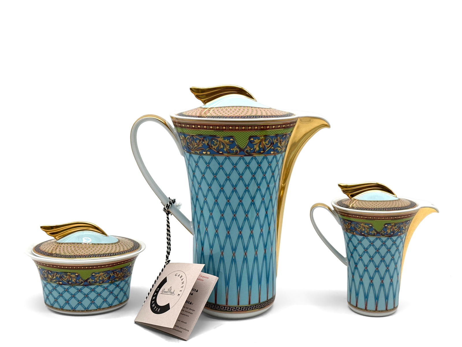 Versace x Rosenthal Russian Dream Tea Set: A Versace x Rosenthal Russian Dream porcelain set including lidded coffee pot, lidded creamer and lidded sugar bowl. Each having ornate painted decoration with Greek key scroll design and gilt detail.