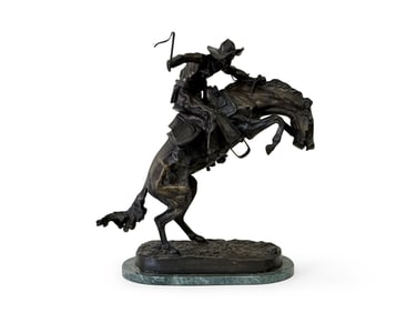 After Frederic Remington Bronze. The Bronco Buster