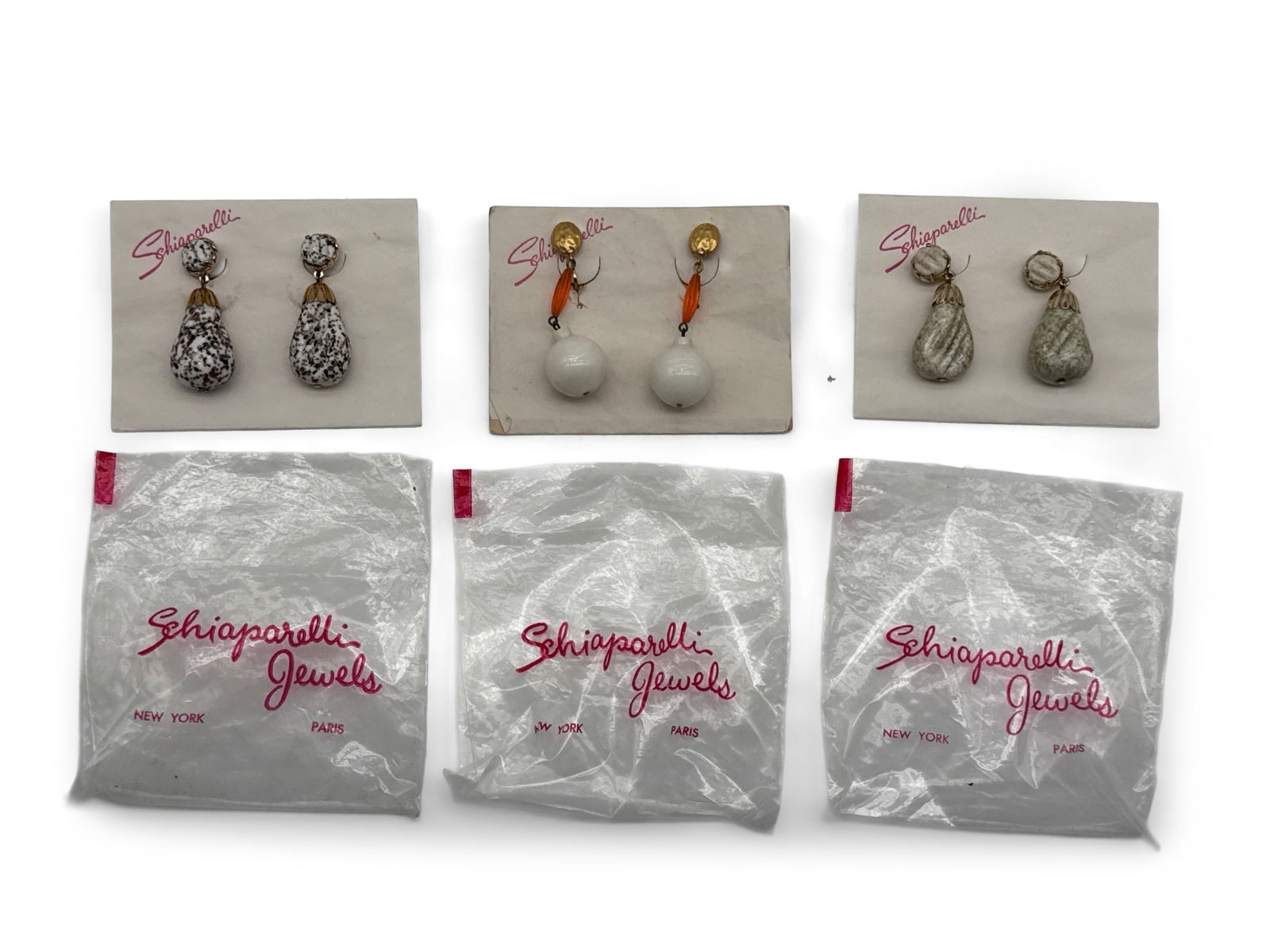 Three Sets Schiaparelli Costume Drop Earrings: Three sets of Schiaparelli costume drop earrings. Original cards. Earrings are unmarked. Largest earrings: 2-1/2 in long. | You have additional shipping options, and are not required to use Live Shipp