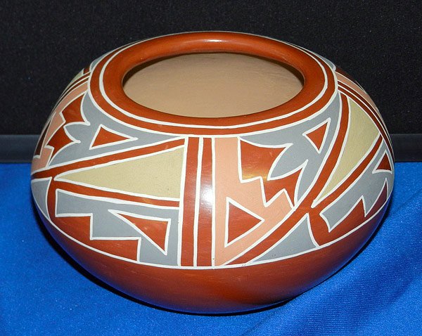 Belen Tapia. Pueblo Pottery Bowl: Pueblo redware pottery bowl with polychrome design. Signed "Belen Tapia" on bottom. 4" tall; 7" diameter.