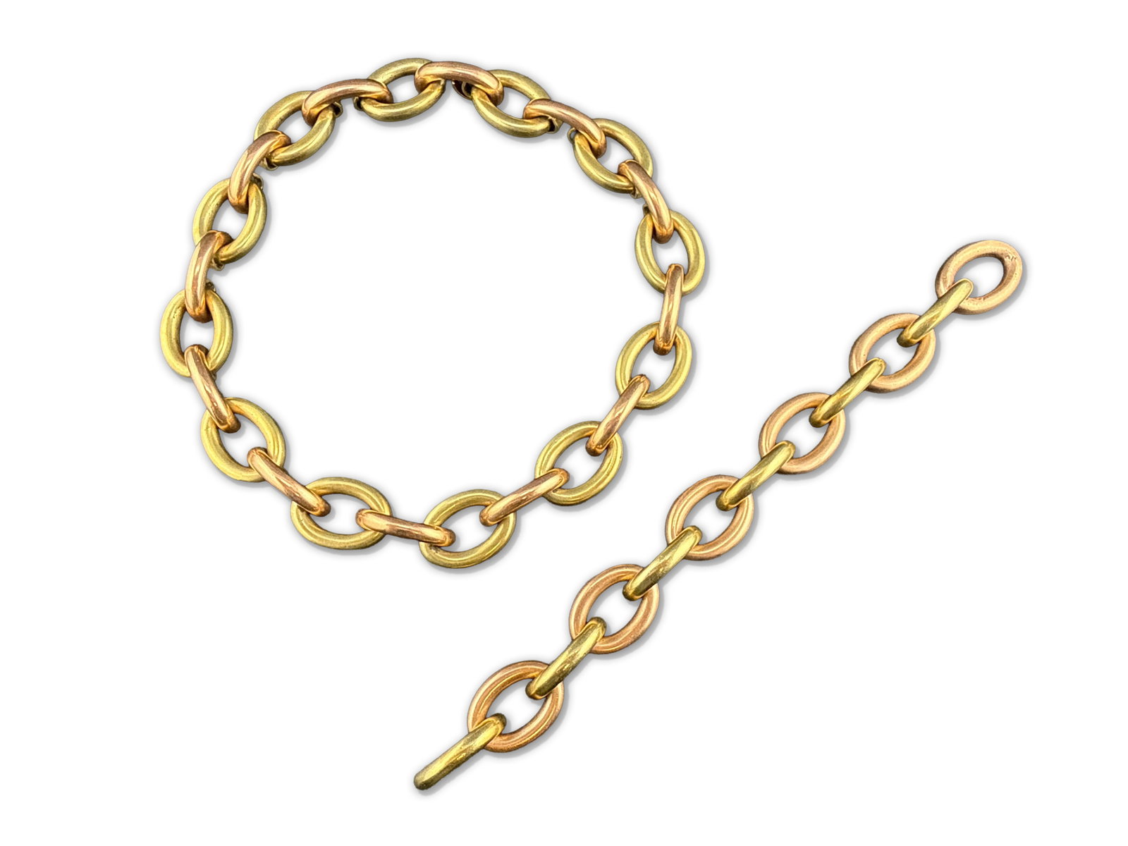 14K Two-Tone Gold Link Jewelry Suite: A 14K two-tone gold ring-link necklace and matching bracelet. Both marked 14K. Bracelet and necklace can connect to make a long necklace. 56.15 total dwt. Necklace: 15in long. Bracelet: 7-1/2in. | You