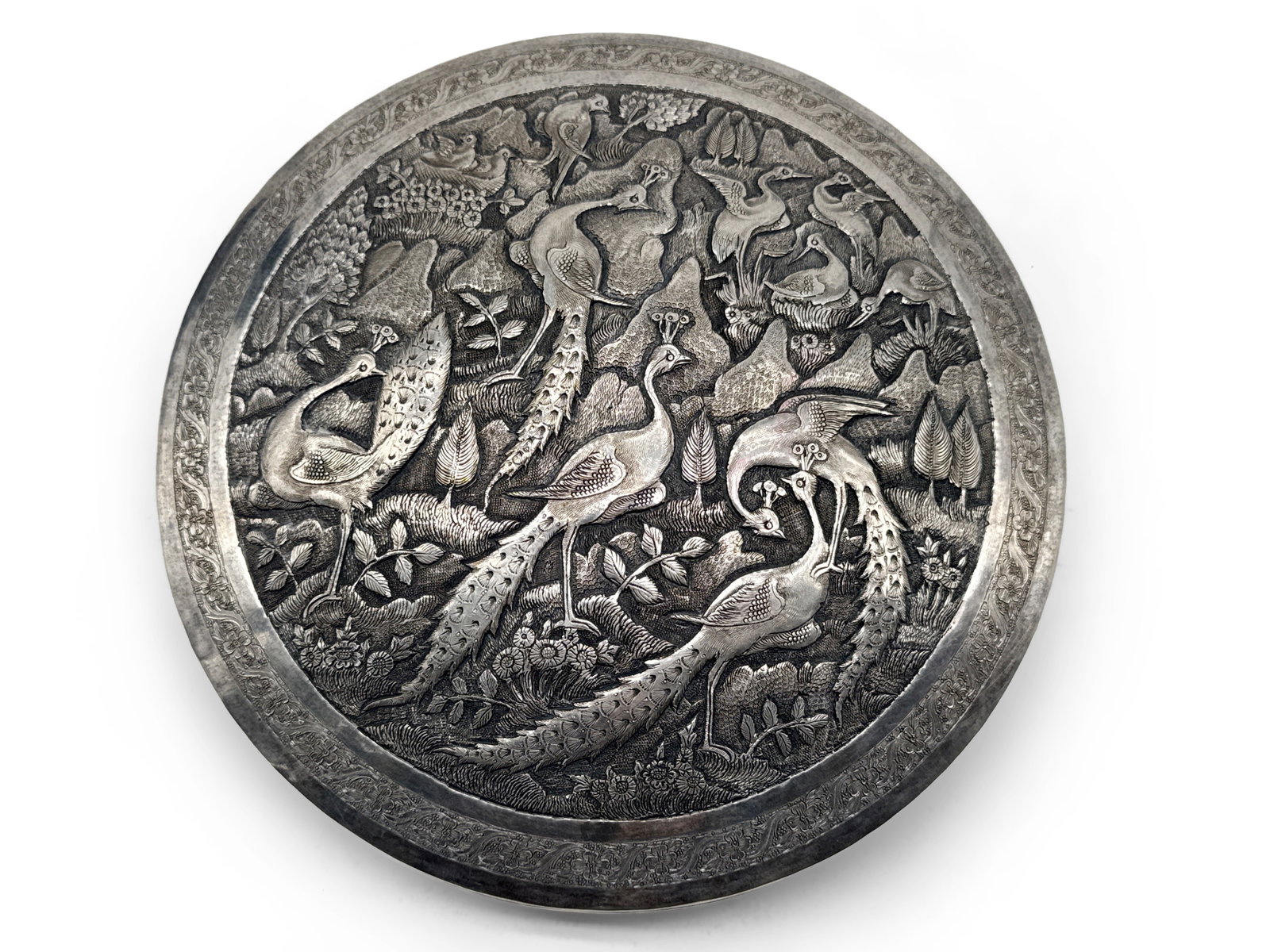 Persian Silver Repoussé Peacock Lidded Box: A Persian silver box with repoussé peacock and woodland motif. Hallmarked. 21.6 ozt. 1-1/2in tall x 7-1/2in wide. | You have additional shipping options, and are not required to use Live Shipping. Ad