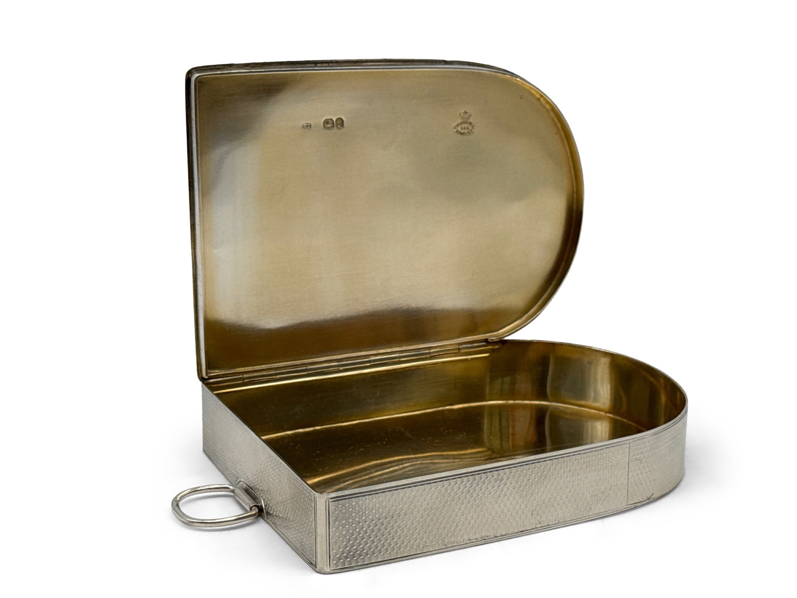 Thomas Johnson Sterling Silver Sandwich Box: A Thomas Johnson (English, 19th C.) sterling silver sandwich box of rectangular form with rounded end, suspension ring, central circular cartouche engraving, monogrammed crest, and gilt wash interior.