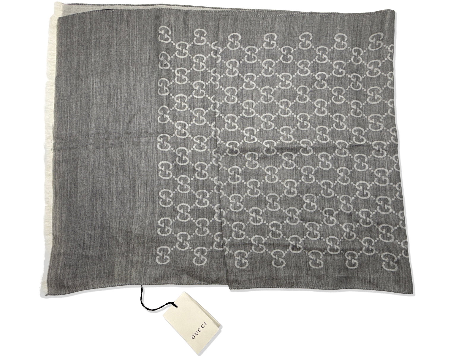 Gucci GG Monogram Grey Wool Scarf: A Gucci GG monogram wool scarf with original tags. 17-3/4in tall x 70-3/4in wide. | You have additional shipping options, and are not required to use Live Shipping. Additional third-party shipper deta