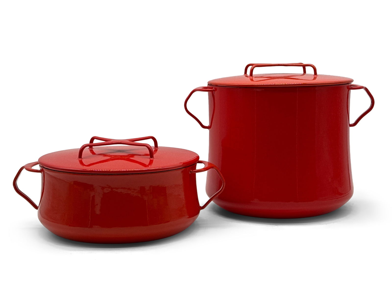 Dansk Kobenstyle Stock Pot and Casserole: A Dansk Kobenstyle red enameled covered stock pot and a matching covered casserole. Provenance: From the collection of Dr. John Shea of Philadelphia, PA. Stock pot: approx. 9in tall x 12in wide. | You
