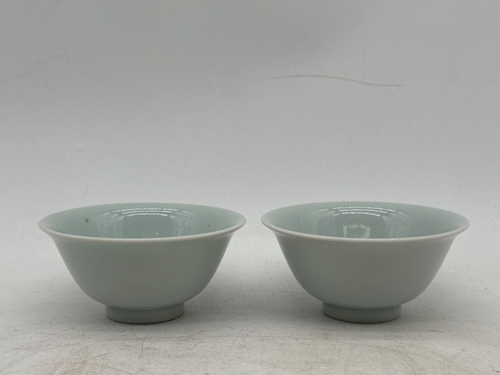 Two Chinese Blue & White Tea Bowls: Two Chinese blue and white tea bowls with interior character marks and six-character mark on bottom rim. 2in tall x 4in wide. | You have additional shipping options, and are not required to use Live S