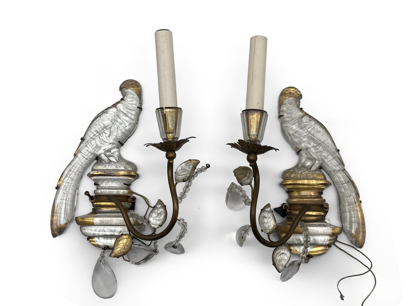 Maison Bagues-Style Parrot Sconces: A pair of Maison Bagues-style brass candelabra wall sconces with single candle arms, parrot forms, and crystal drops. 10-1/2 in tall x 7 in wide. | You have additional shipping options, and are not