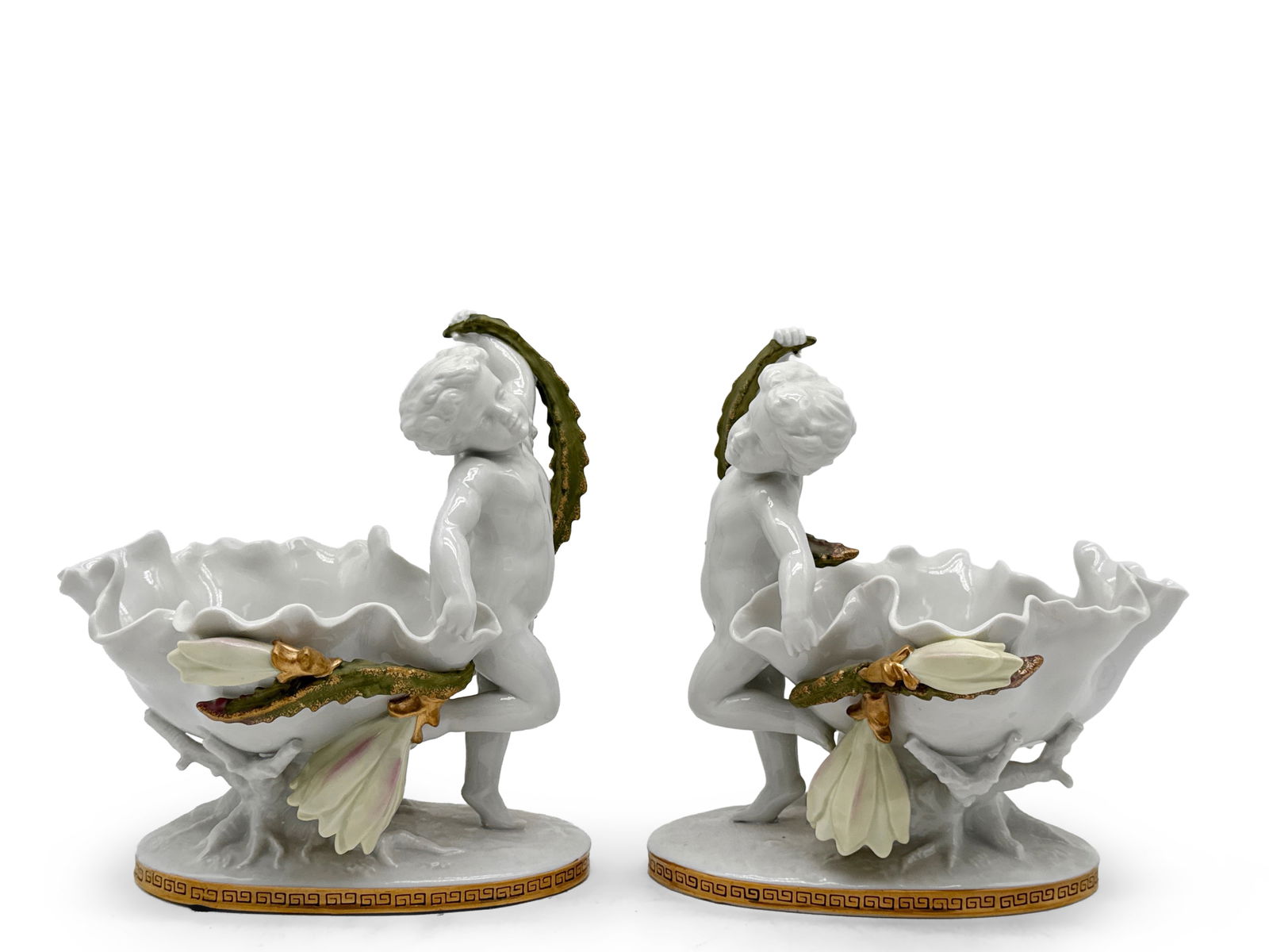 Pair of Continental Porcelain Figural Bowls: A pair of Continental porcelain figural bowls with cherubs. 9in tall x 7in wide. | You have additional shipping options, and are not required to use Live Shipping. Additional third-party shipper