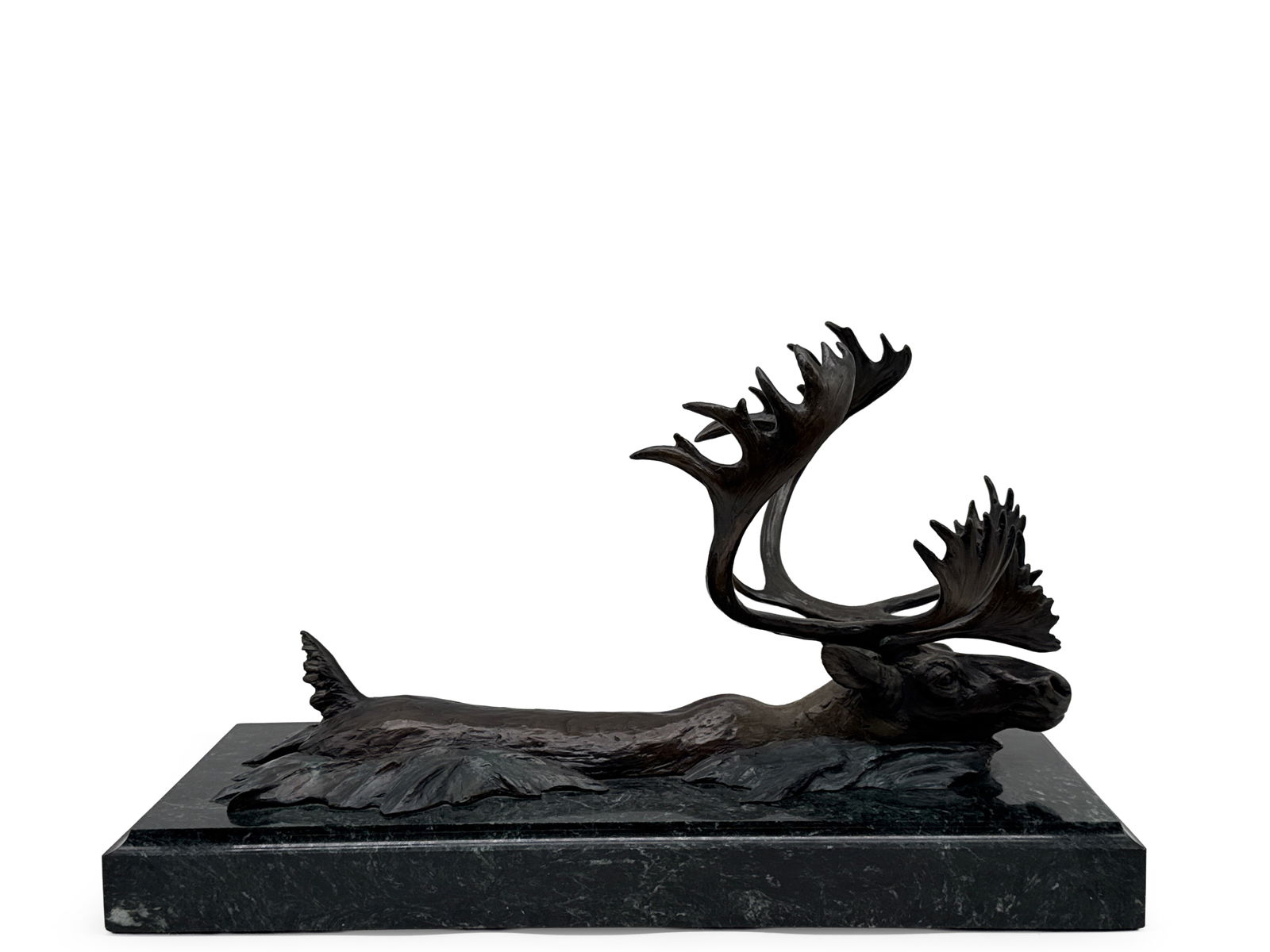 David H. Turner Bronze: Caribou: David H. Turner (Virginia, 20th C). A bronze sculpture of caribou swimming through waters, terminating on a green marble plinth. Signed. Includes Certificate of Origin, signed by David H. Turner,