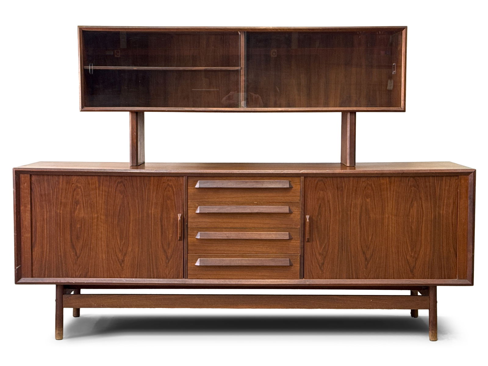 Danish Modern Teak Sideboard with China Cabinet Top: A two-piece Danish modern teak sideboard credenza, with drawers flanked by tambour door cabinets, and with a removable china cabinet top with sliding glass doors. 55-3/4in tall x 80in wide x 19in deep