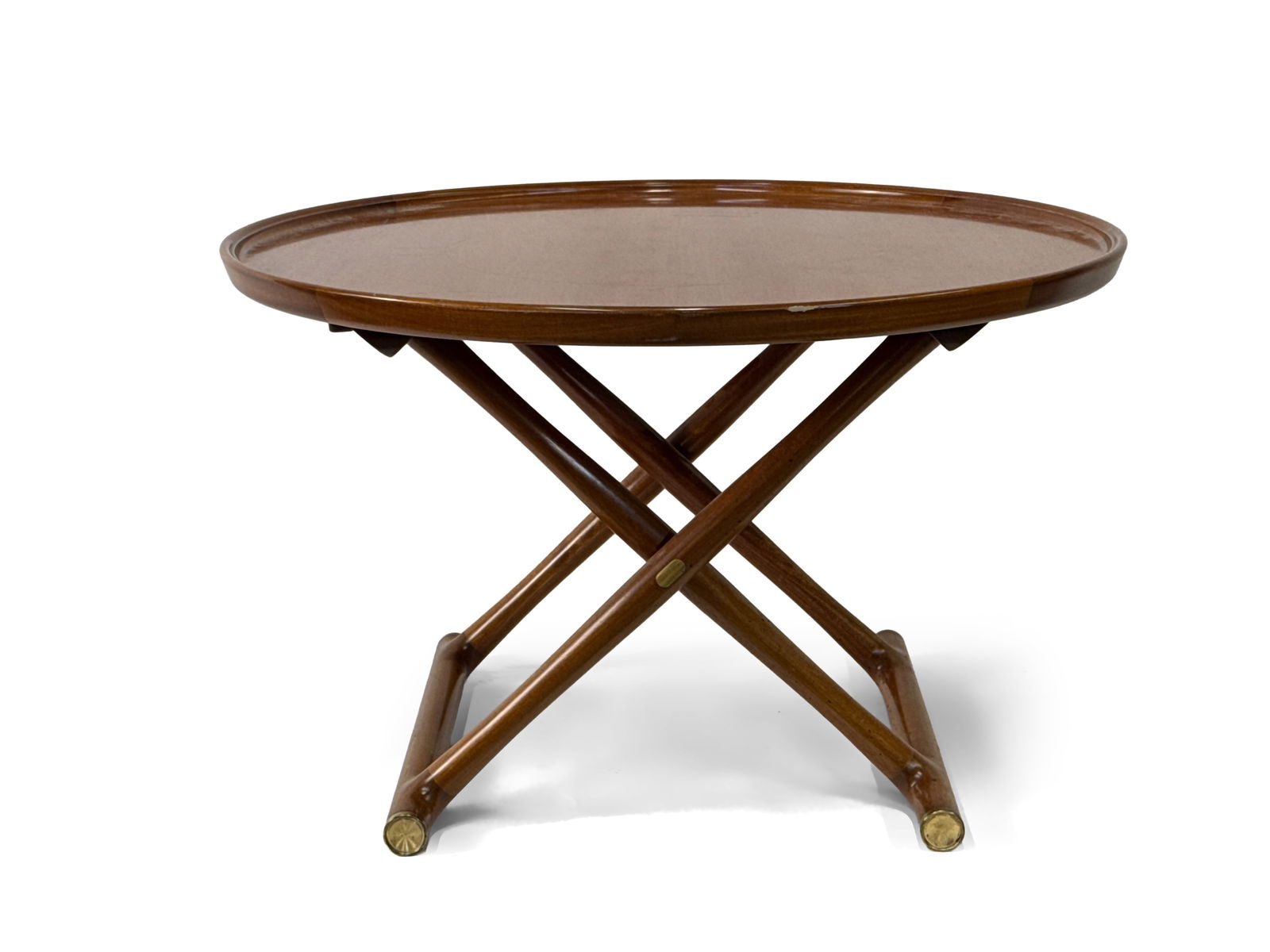 Mogens Lassen Egyptian Coffee Table: A Mogens Lassen for Rud. Rasmussens Snedkerier, Danish mahogany "Egyptian" coffee table with a circular top over a folding X-base with brass-capped legs. Unmarked. Provenance: From the collection of D