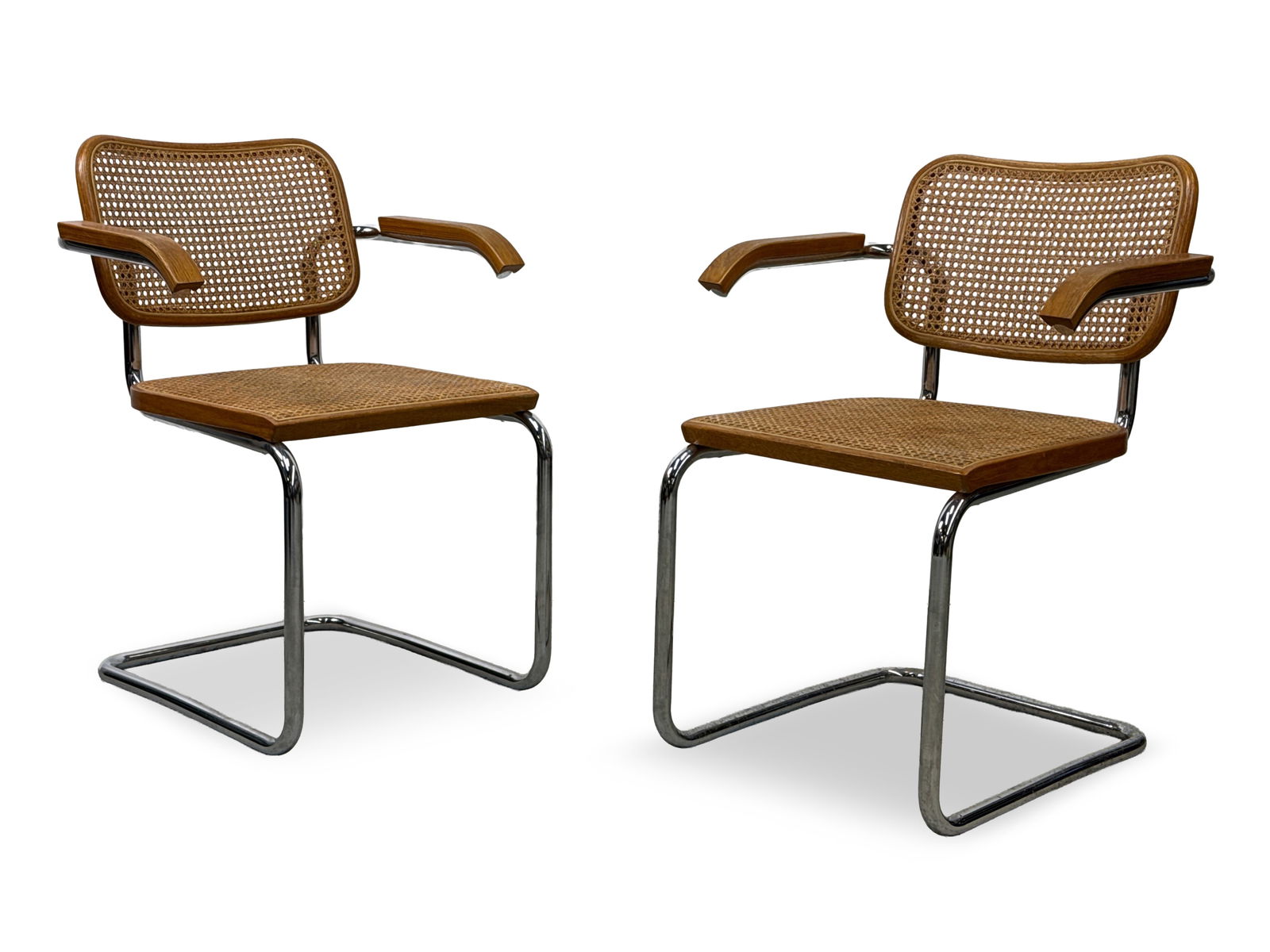 Pair of Marcel Breuer for Knoll Cesca Chairs: A pair of Marcel Breuer for Knoll International Cesca cantilever tubular chrome armchairs. Provenance: From the collection of Dr. John Shea of Philadelphia, PA. 31in tall x 23-1/2in wide x 22in deep.
