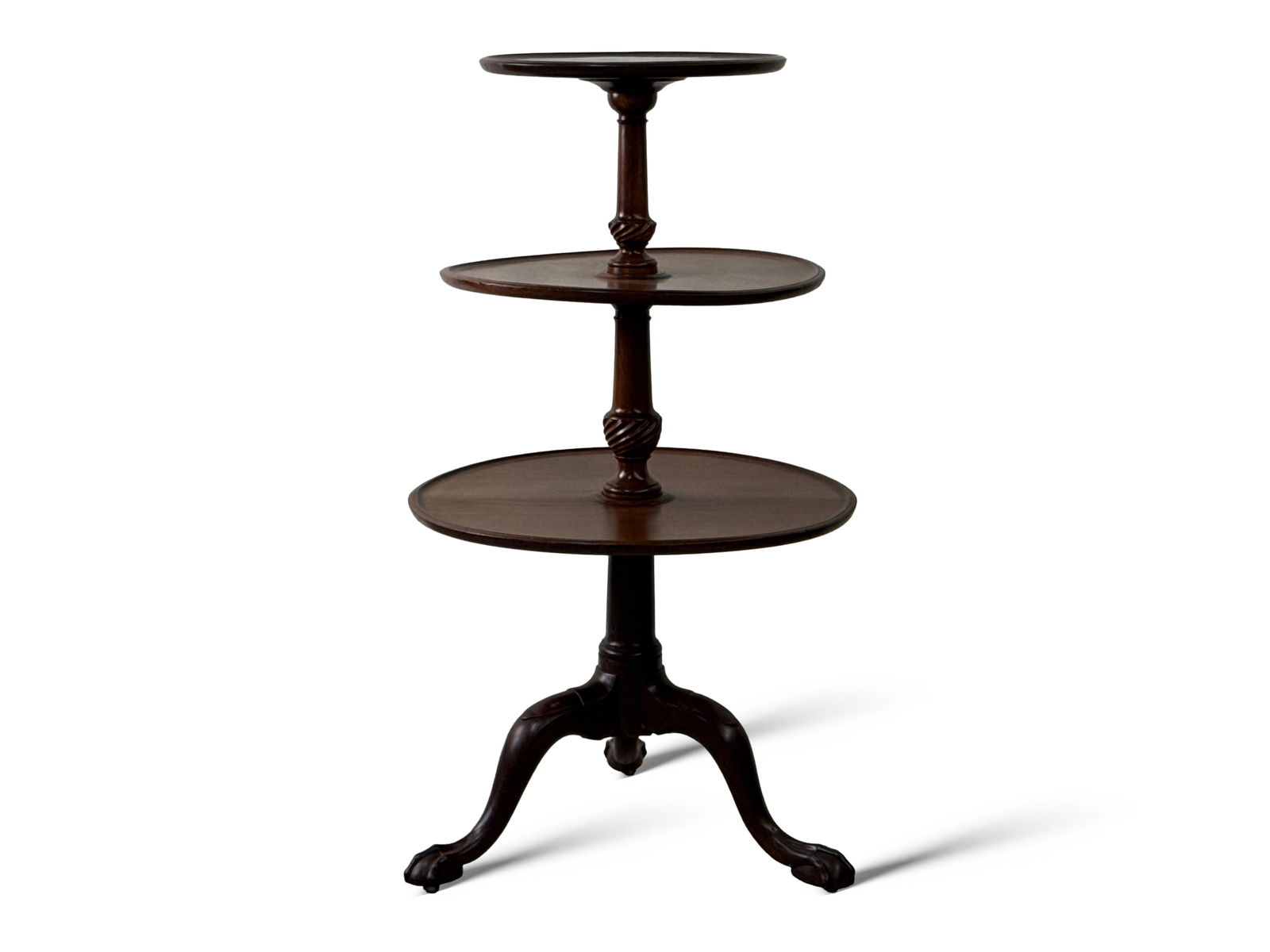 Georgian Mahogany Three-Tiered Dumbwaiter: A Georgian mahogany three-tiered dumbwaiter with turned and carved shafts raised on cabriole legs with ball and claw feet on casters. 42in tall x 23in wide. | You have additional shipping options, and