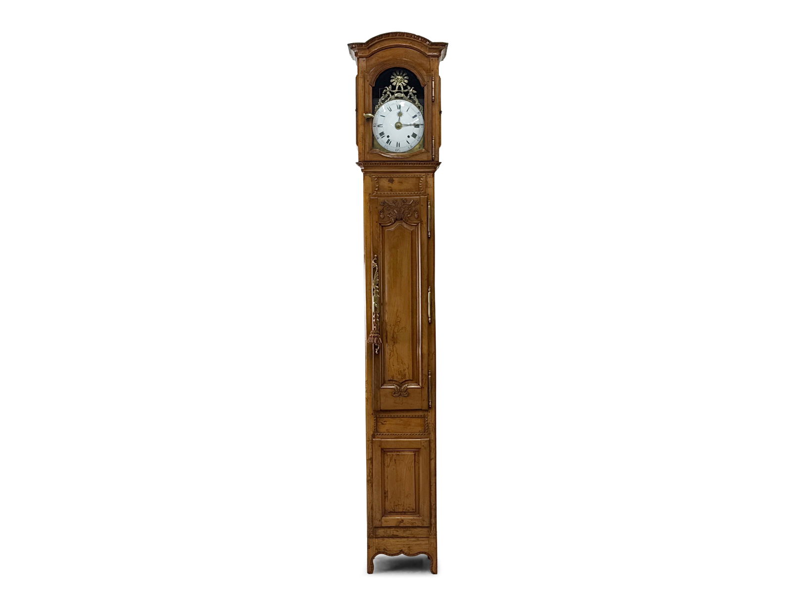 French Provincial Tall Case Clock: A 19th C. French Provincial tall case clock with an enamel and brass dial in a carved case. Two weight driven. 99in tall x 15-3/4in wide x 10in deep. | You have additional shipping options, and are