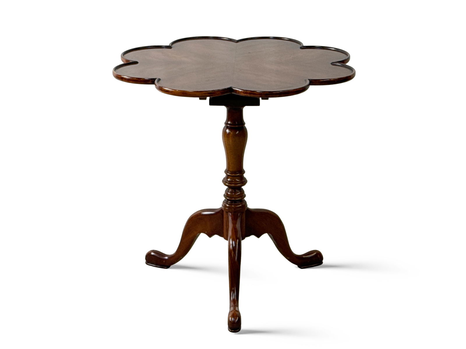 English Mahogany Tilt-Top Tea Table: An English mahogany tilt-top tea table with a shaped top, and brass plaque on the underside: "Handmade by Trosby Furniture of Sussex England". 26-1/2in tall x 27in wide. | You have additional