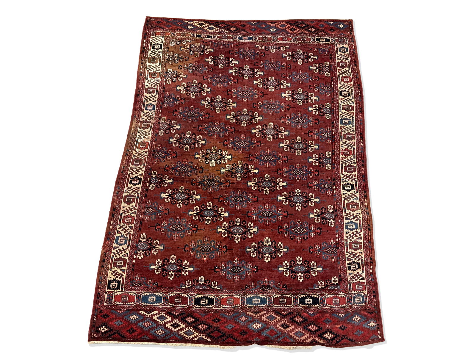 Turkoman Yomud Area Carpet, 10ft 4in x 7ft 2in: A Turkoman Yomud area carpet with a repeating medallion design and red ground. 10ft 4in x 7ft 2in. | You have additional shipping options, and are not required to use Live Shipping. Additional