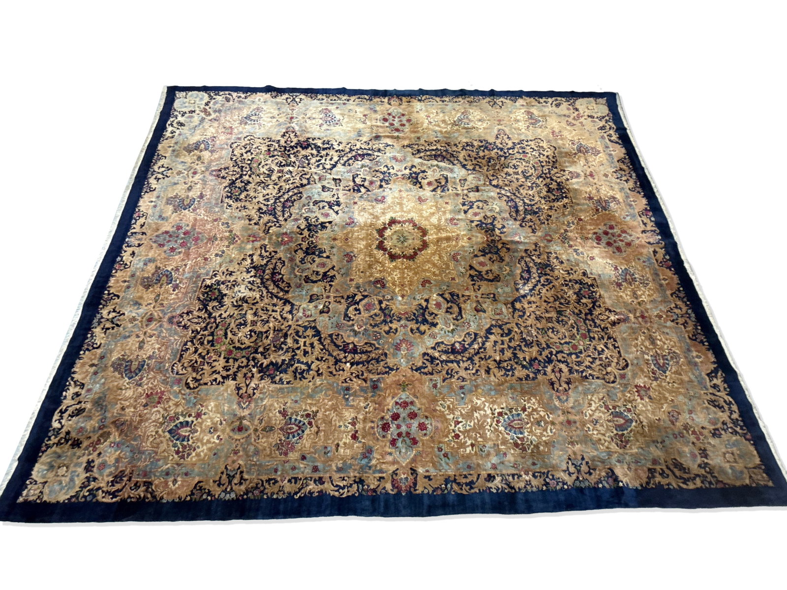 Kirman Palace-Size Carpet, 16ft 6in x 14ft: A Kirman palace-size carpet with a large central foliate medallion. 16ft 6in x 14ft. | You have additional shipping options, and are not required to use Live Shipping. Additional third-party shipper d