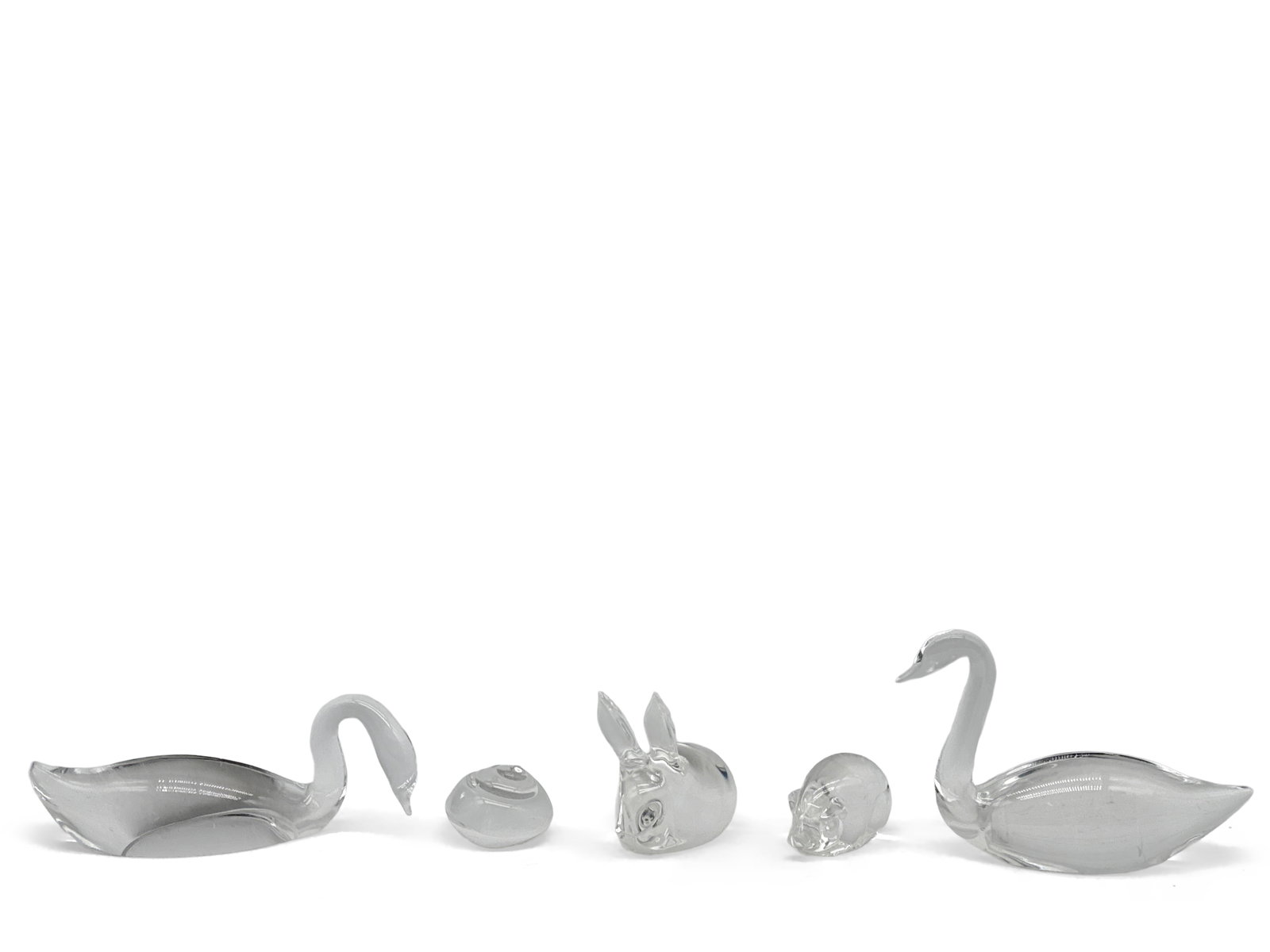 Five Steuben Animal Figures: Five Steuben glass animal-form figures to include snail, rabbit, pig, and swans. All signed Steuben. Largest: 5in tall x 6in wide. | You have additional shipping options, and are not required to use