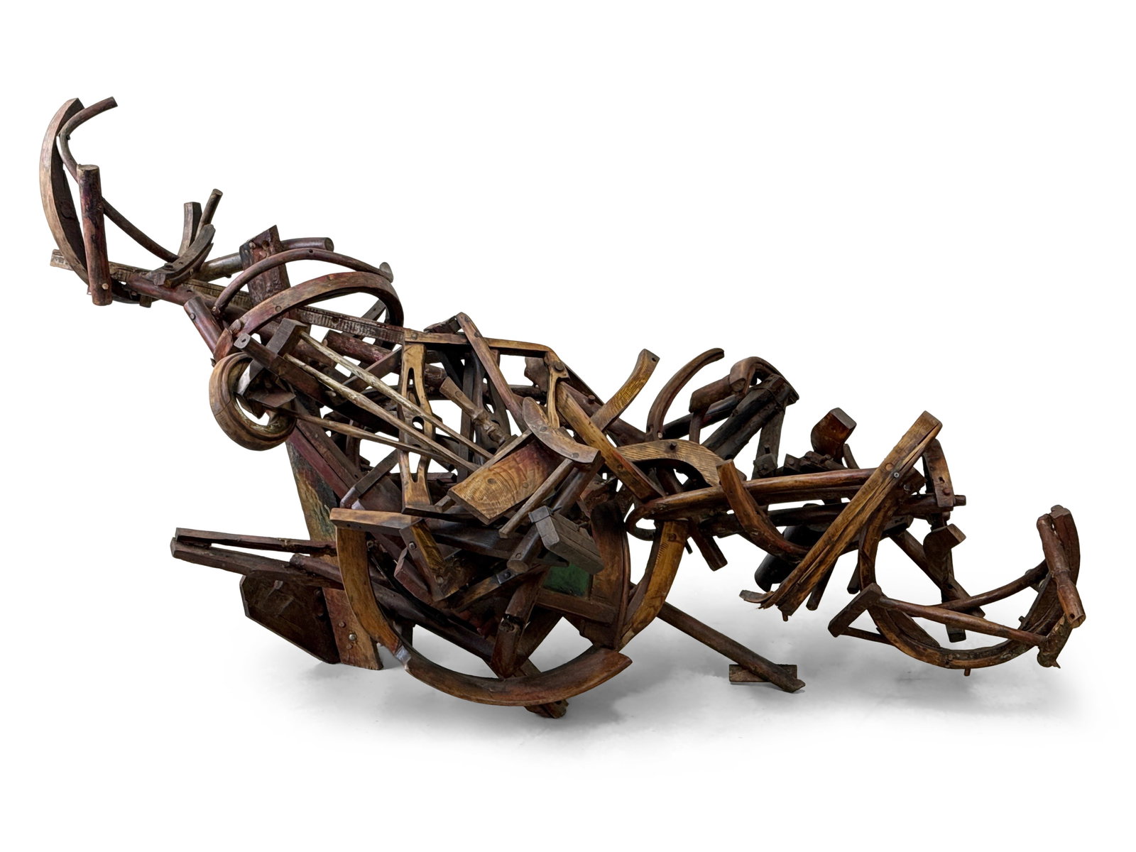 Michael G. Gilligan Found Object Sculpture: Michael G. Gilligan (American, 1936-2025). A found object sculpture composed of interlocking chairs and chair parts. 41in tall x 77in wide x 41in deep. | You have additional shipping options, and are