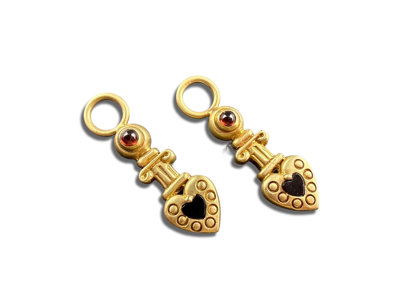Pair of 14K Yellow Gold Cabochon Charms: A pair of 14K yellow gold heart-shaped cabochon charms. 1-1/2in long. 6 dwt. | You have additional shipping options, and are not required to use Live Shipping. Additional third-party shipper details;