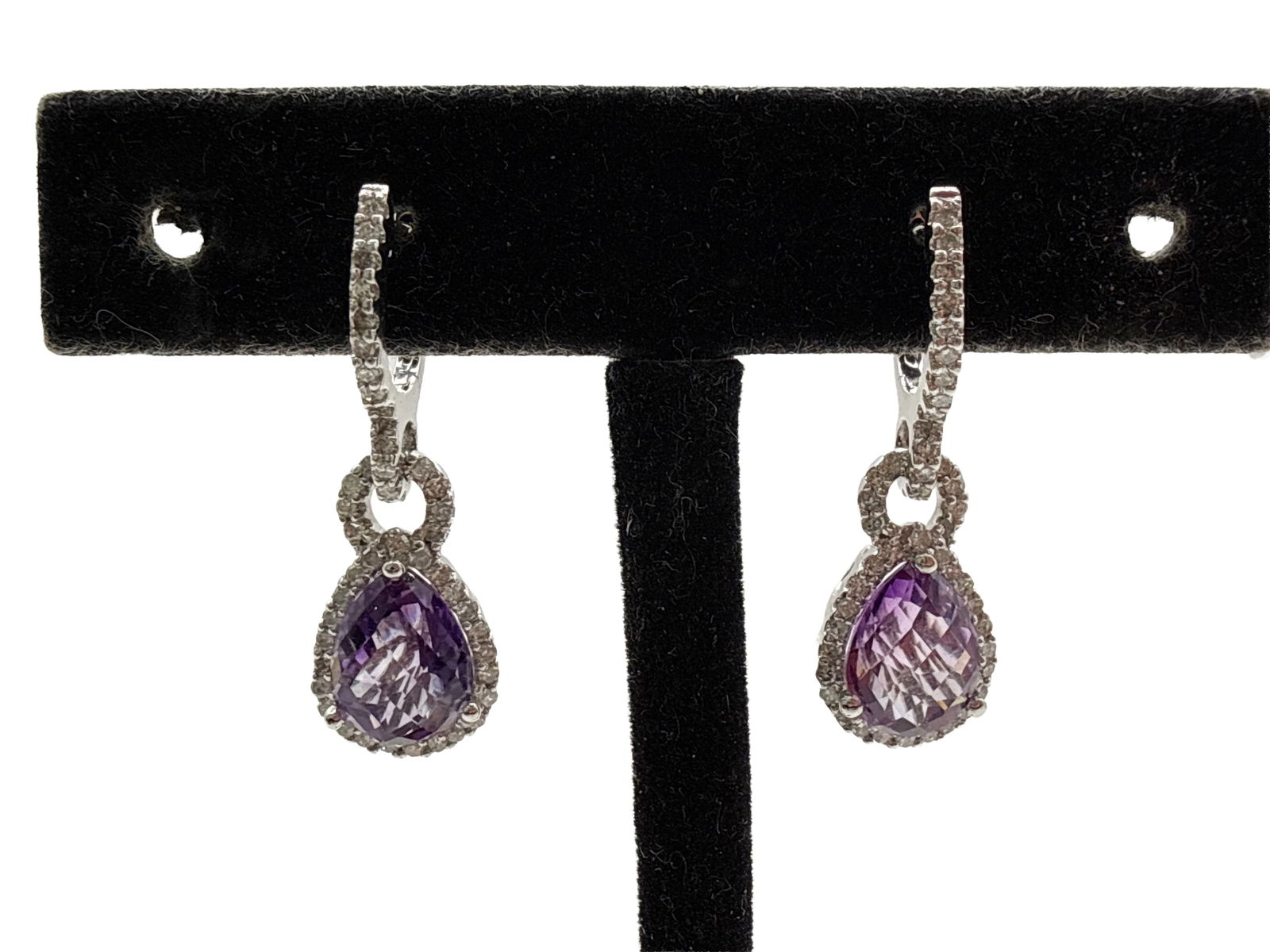 14K White Gold, Diamond, and Amethyst Drop Earrings: A pair of 14K white gold earrings with pear-cut amethyst and diamond drops. 1-1/8in long. 3.2 dwt. | You have additional shipping options, and are not required to use Live Shipping. Additional third-p