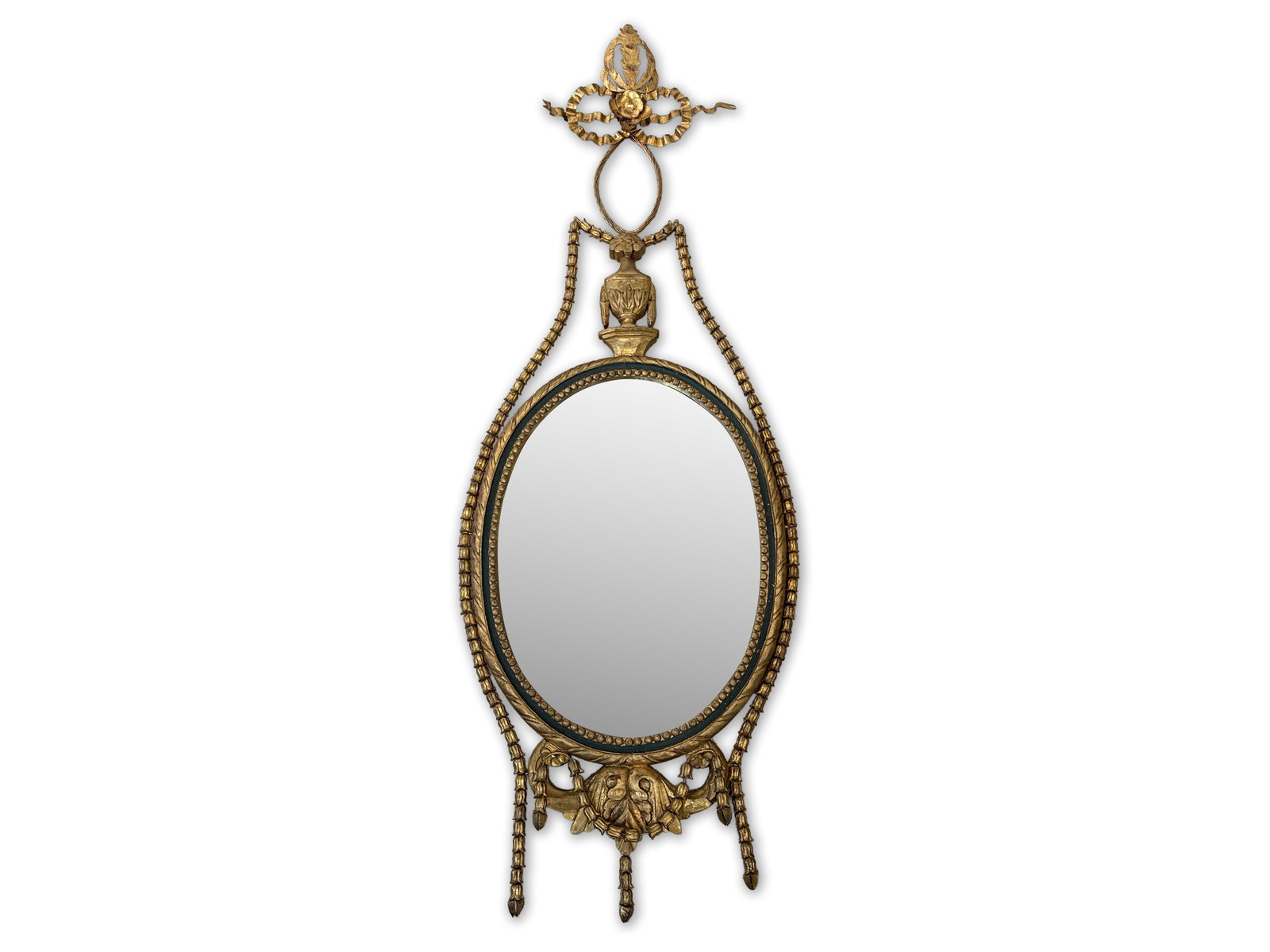 George III-style Oval Gilt Mirror: A George III-style gilt wall mirror of neoclassical form with bellflower swag. 67in tall x 24in wide. | You have additional shipping options, and are not required to use Live Shipping. Additional thir