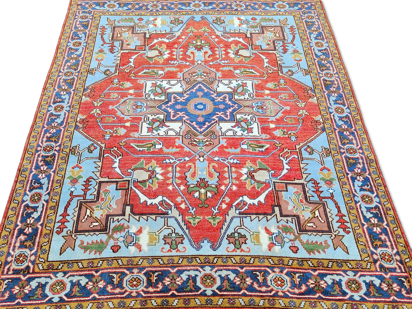 Turkish Heriz Hand-Knotted Carpet, 7ft 11in x 9ft 11in: A Turkish hand-knotted carpet with light-blue ground. 7ft 11in x 9ft 11in. | You have additional shipping options, and are not required to use Live Shipping. Additional third-party shipper details; Ph
