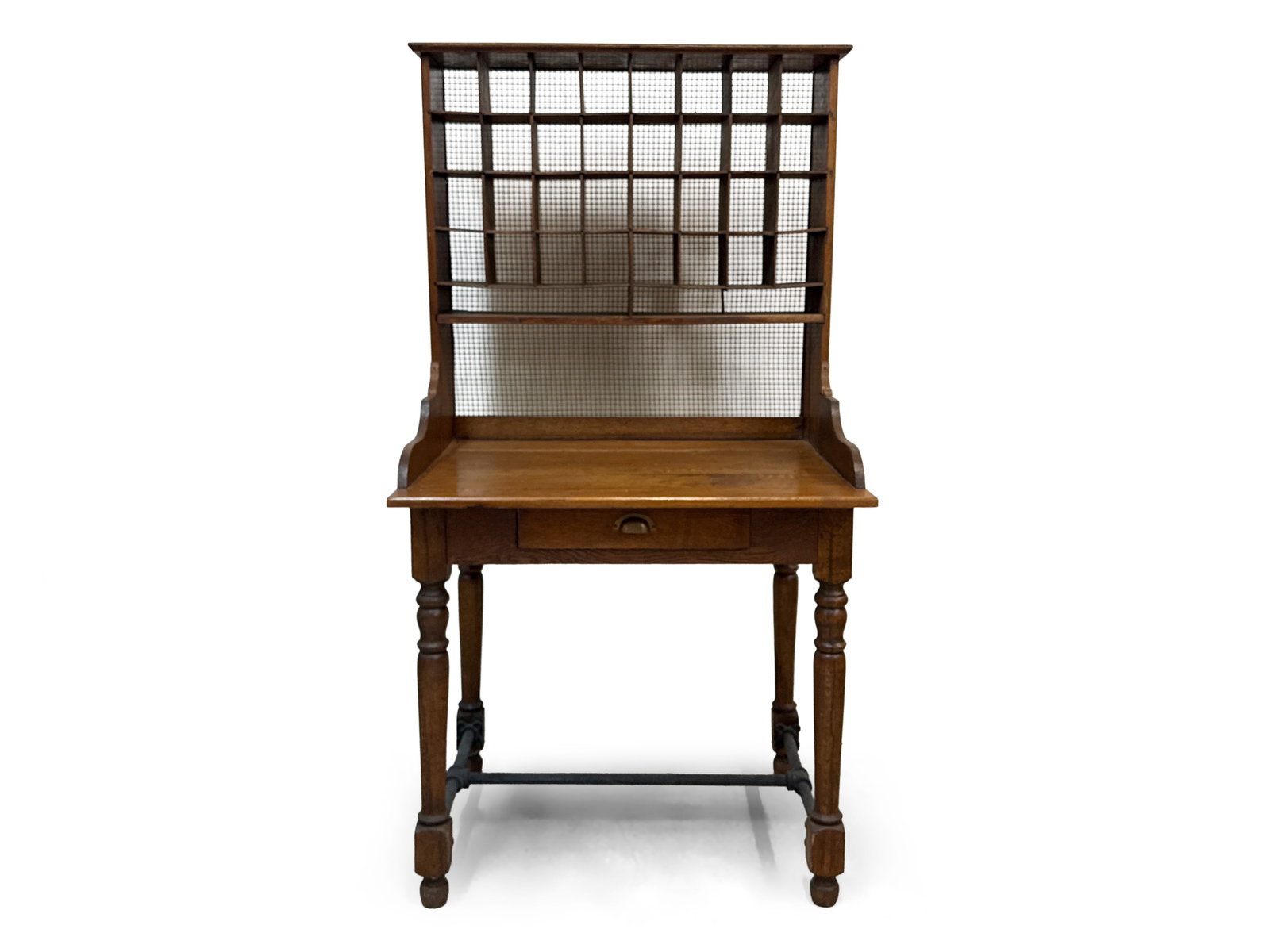Victorian Oak Post Office Desk: A Victorian oak post office desk with an open cubby top over a desk surface with single drawer and turned legs joined by a later pipe stretcher. 69in tall x 36in wide x 29in deep. | You have additiona
