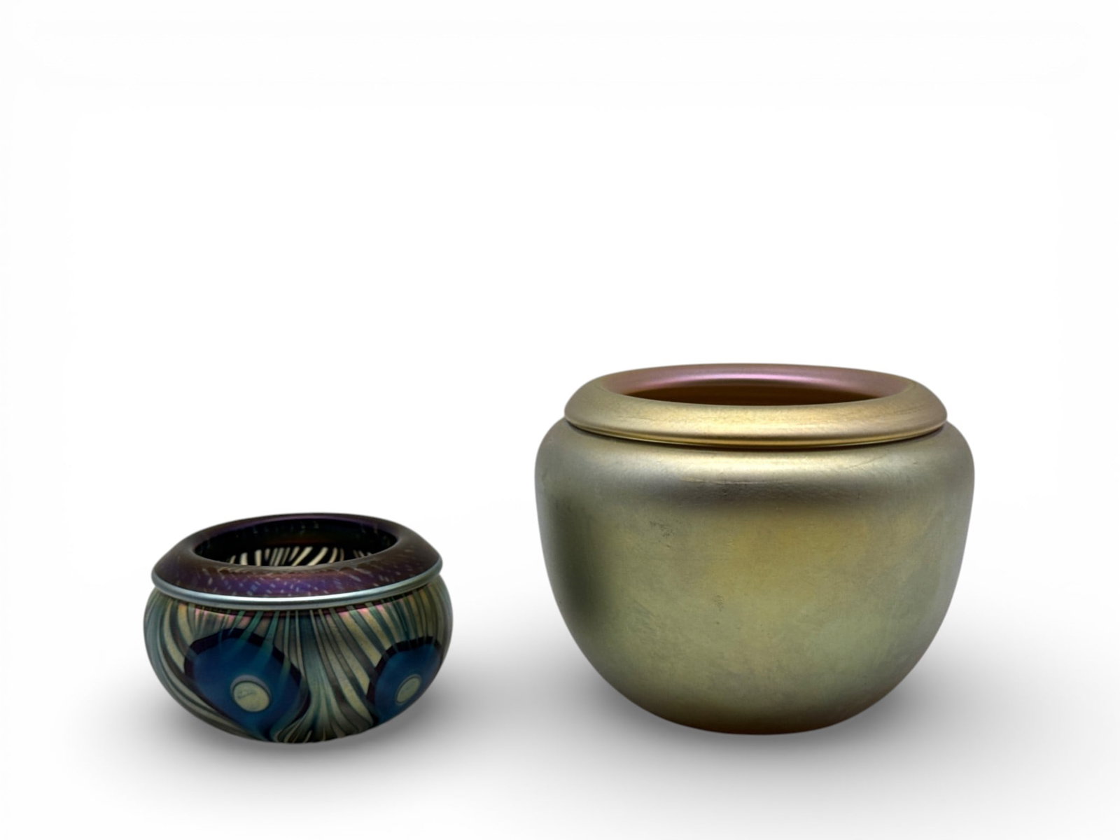 Jeremiah and John Lotton Art Glass Bowls: A Jeremiah Lotton diminutive iridescent art glass bowl with pulled-feather design, signed; and a John Lotton aurene bowl with folded rim, signed. Larger: 1-1/2in tall x 2in wide. | You have additional