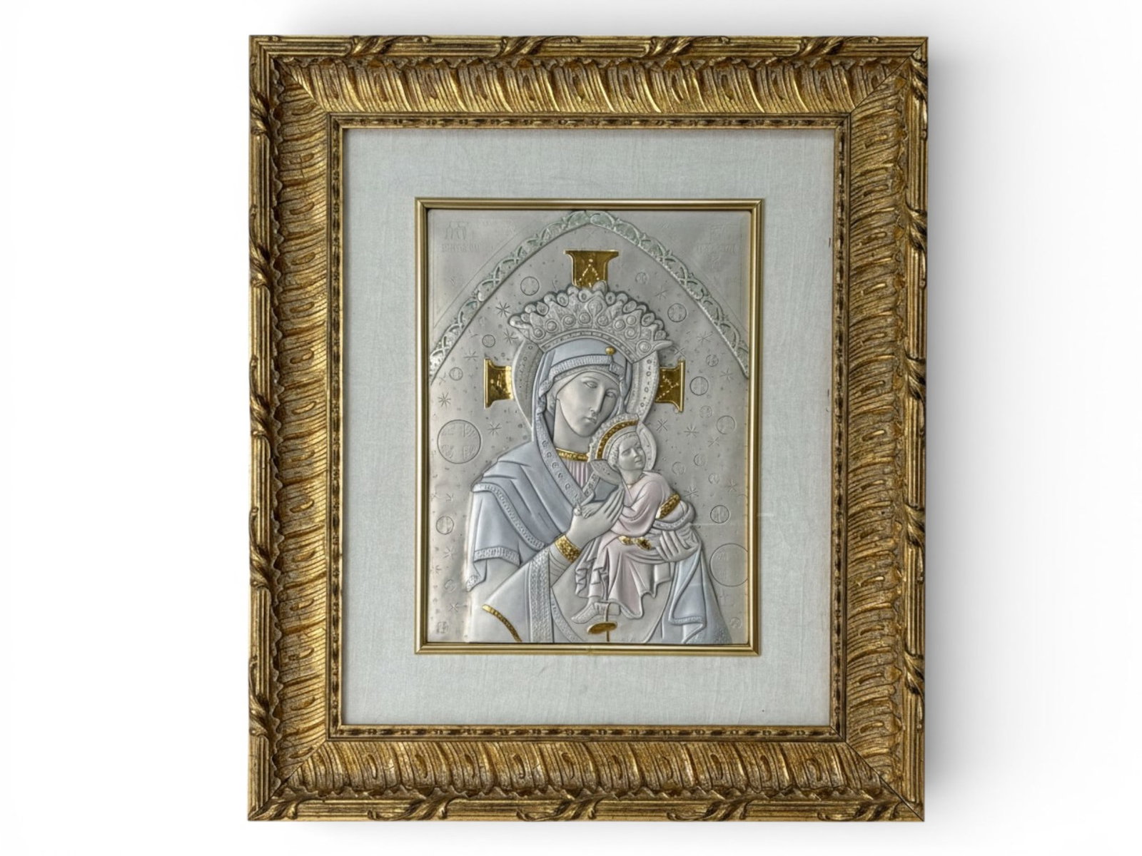 A Silver Sheet Diffusione Arte Religious Icon: A silver Diffusione Arte religious icon in a gilt frame. Sight: 15-1/2in x 11-1/2in. Outside frame: 28in x 24in. | You have additional shipping options, and are not required to use Live Shipping. Addi