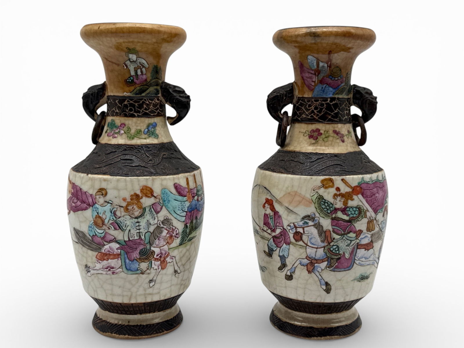 Chinese Nanking Porcelain Vases: A pair of Chinese Nanking crackle glazed porcelain vases with genre motifs and elephant-form handles. 10in tall x 4in wide. | You have additional shipping options, and are not required to use Live