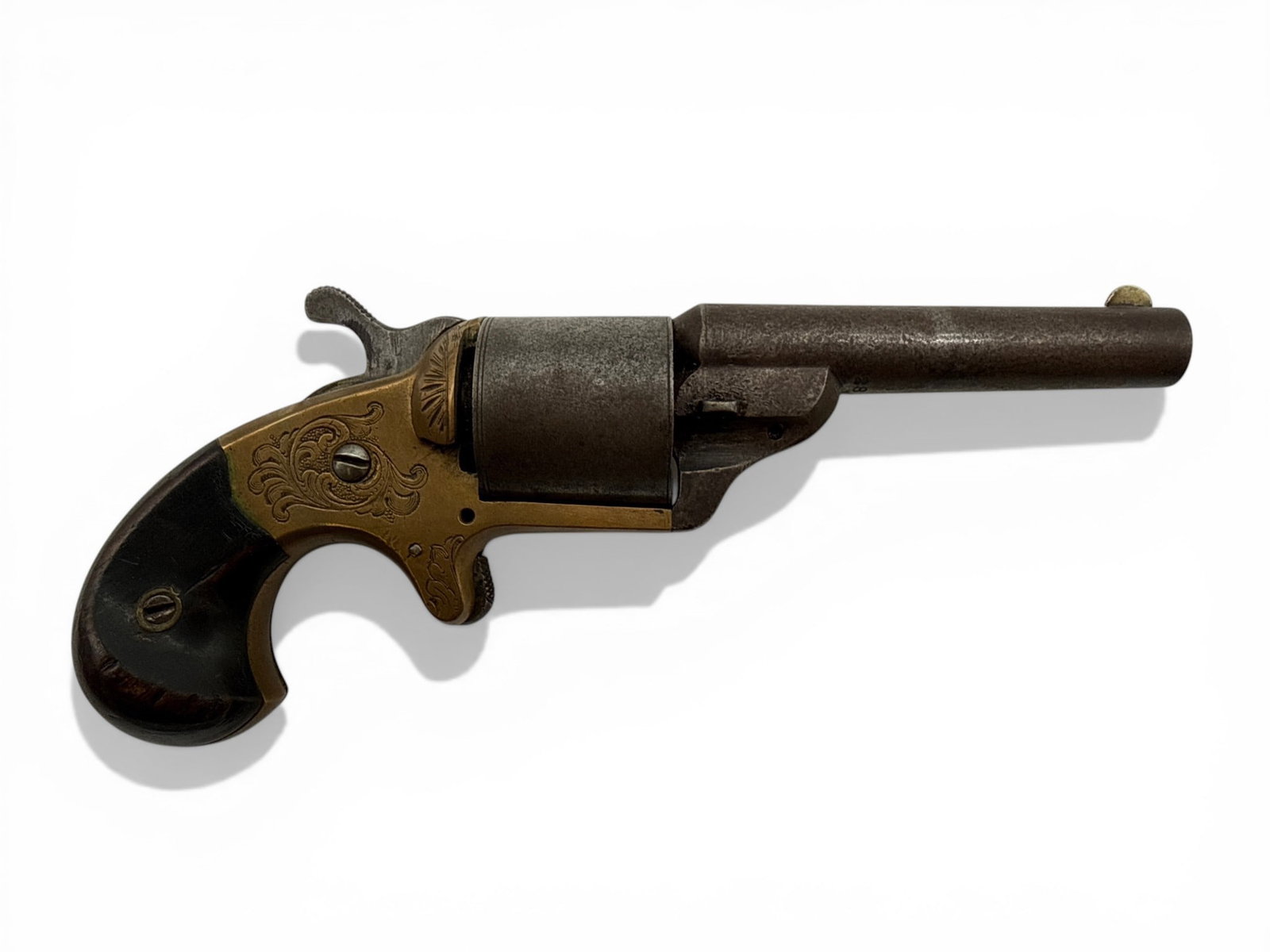 Antique Six-Shot Brass Frame Revolver: An antique six-shot front-loading pocket revolver with an engraved brass frame. 7in long. Barrel length: 3-1/4in. | You have additional shipping options, and are not required to use Live Shipping. Add