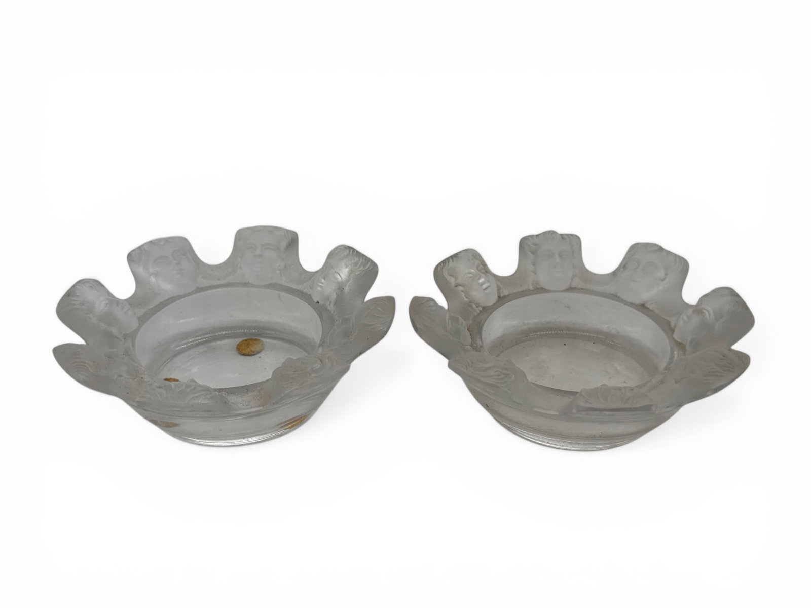 Two Lalique Crystal St. Nicholas Trinket Dishes: Two Lalique crystal trinket dishes with St. Nicholas cherubic borders. Each marked Lalique France. 1-1/2in tall x 4in wide. | You have additional shipping options, and are not required to use Live