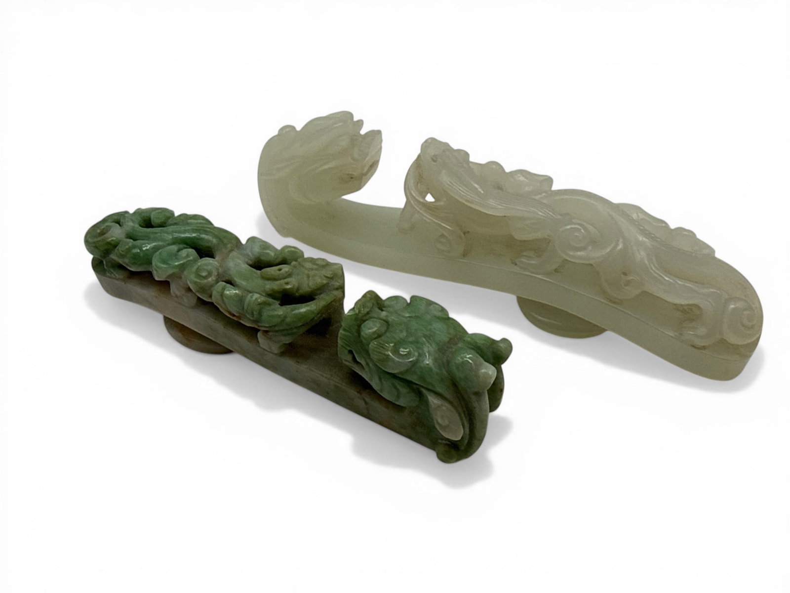 Two Chinese Carved Jade Belt Hooks: Two Chinese carved jade belt hooks with dragon carved decoration. Longer: 4-1/8in long. Shorter: 3-1/2in long. | You have additional shipping options, and are not required to use Live Shipping. Additi