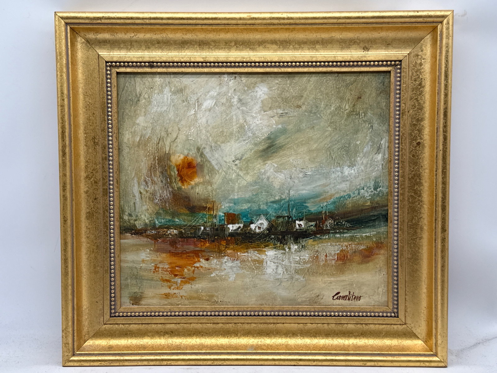Frank Carmelitano Oil/Canvas: Little Village: Frank Carmelitano (American/Spanish, 1935-2003). A gilt wood-framed oil on canvas Impressionist-style harbor scene titled "Little Village". Signed. Canvas: 12-1/2in x 14-1/2in. Frame: 18-1/2in x 20-1/