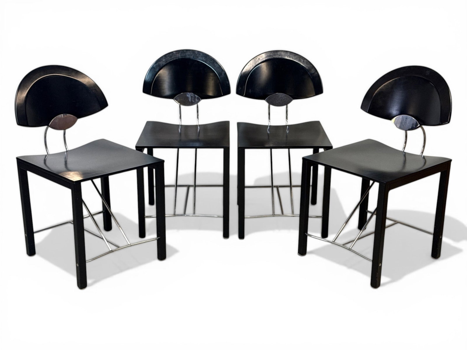 Four Italian Modern Chrome & Ebonized Wood Side Chairs: A set of four Italian Modern chrome and ebonized wood side chairs. Unmarked. 31-1/2in tall x 17in wide x 20in deep. | You have additional shipping options, and are not required to use Live Shipping. A
