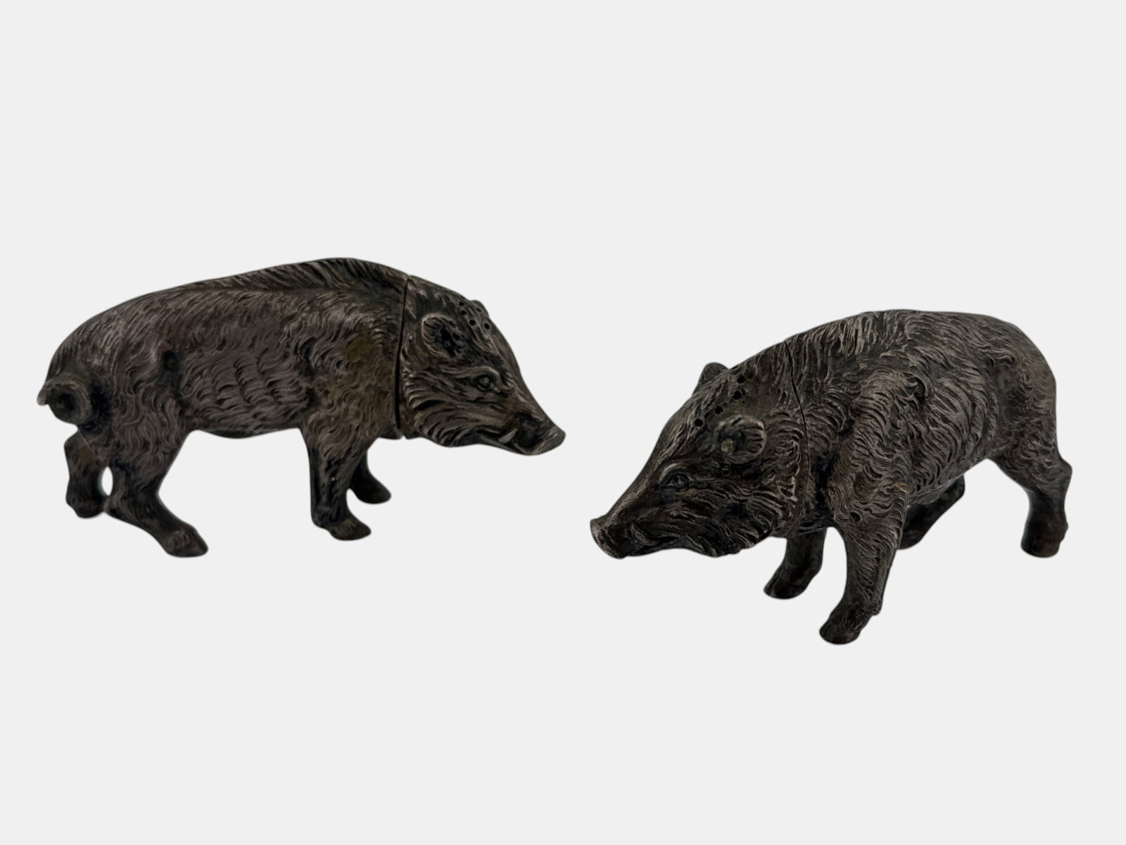 Pair of .800 Silver Boar Salt & Pepper Shakers: A pair of .800 silver figural boar-form salt and pepper shakers. Each: 2in tall x 3-1/2in wide. 6.03 ozt. | You have additional shipping options, and are not required to use Live Shipping. Additional